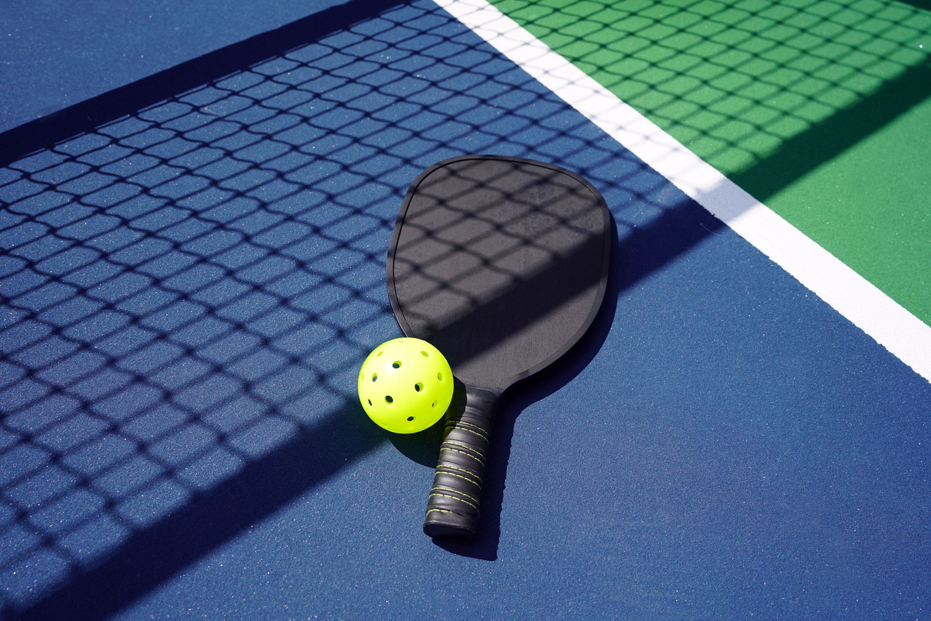 Pickle ball paddle on court